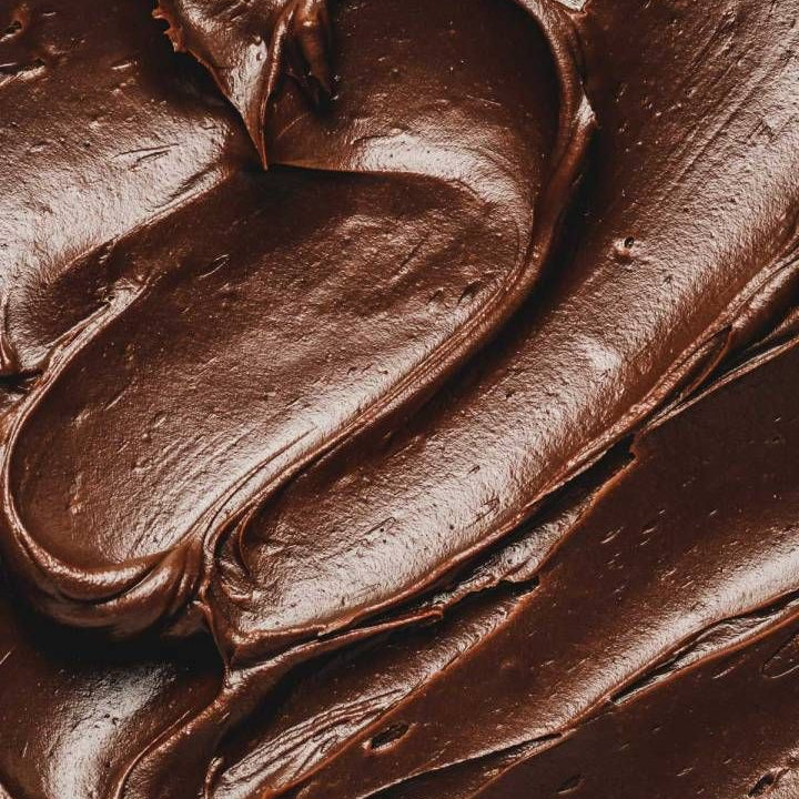 Close-up of smooth chocolate frosting texture